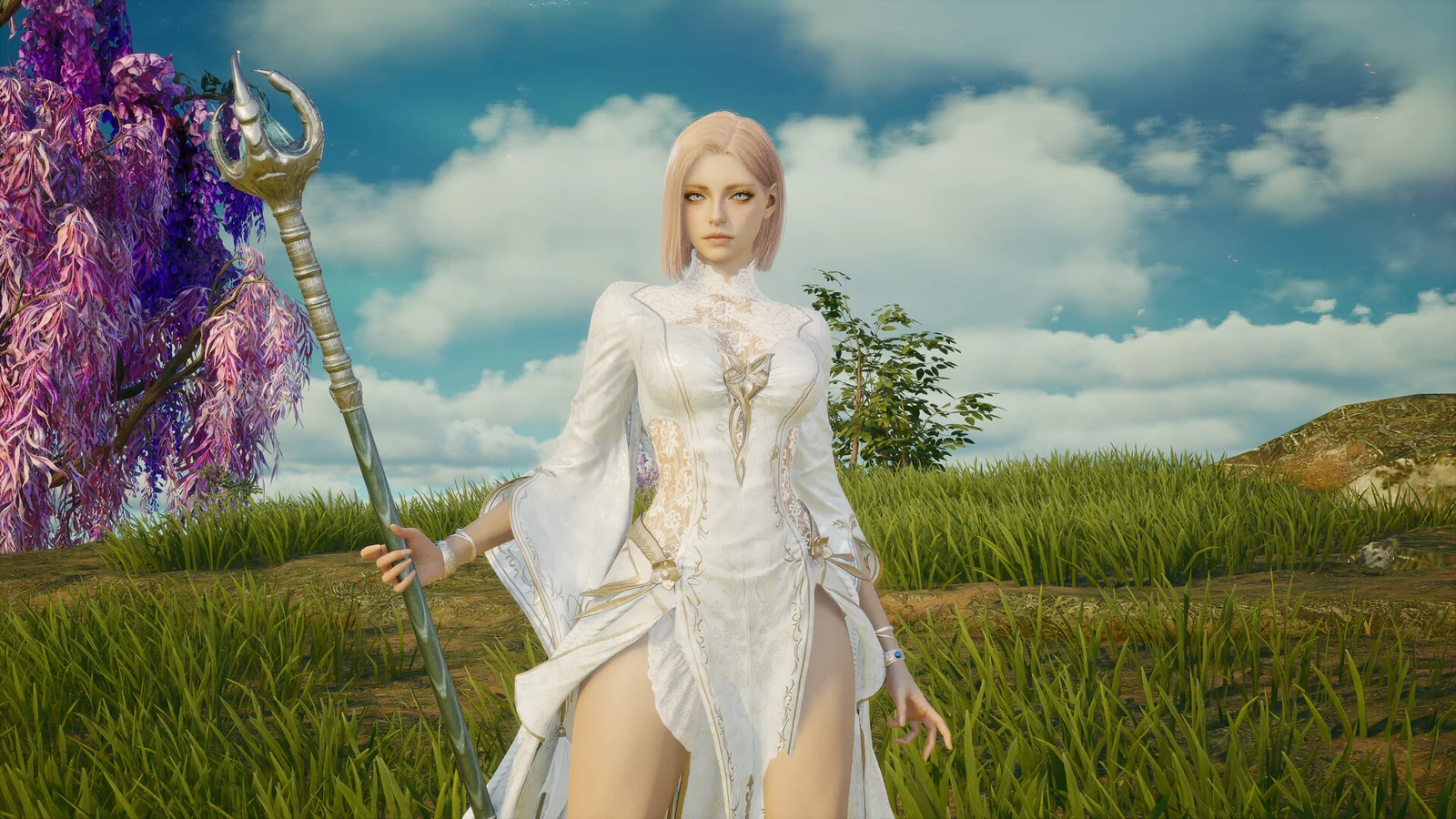 An AION 2 character in a white outfit holds an ornate staff against a colourful landscape