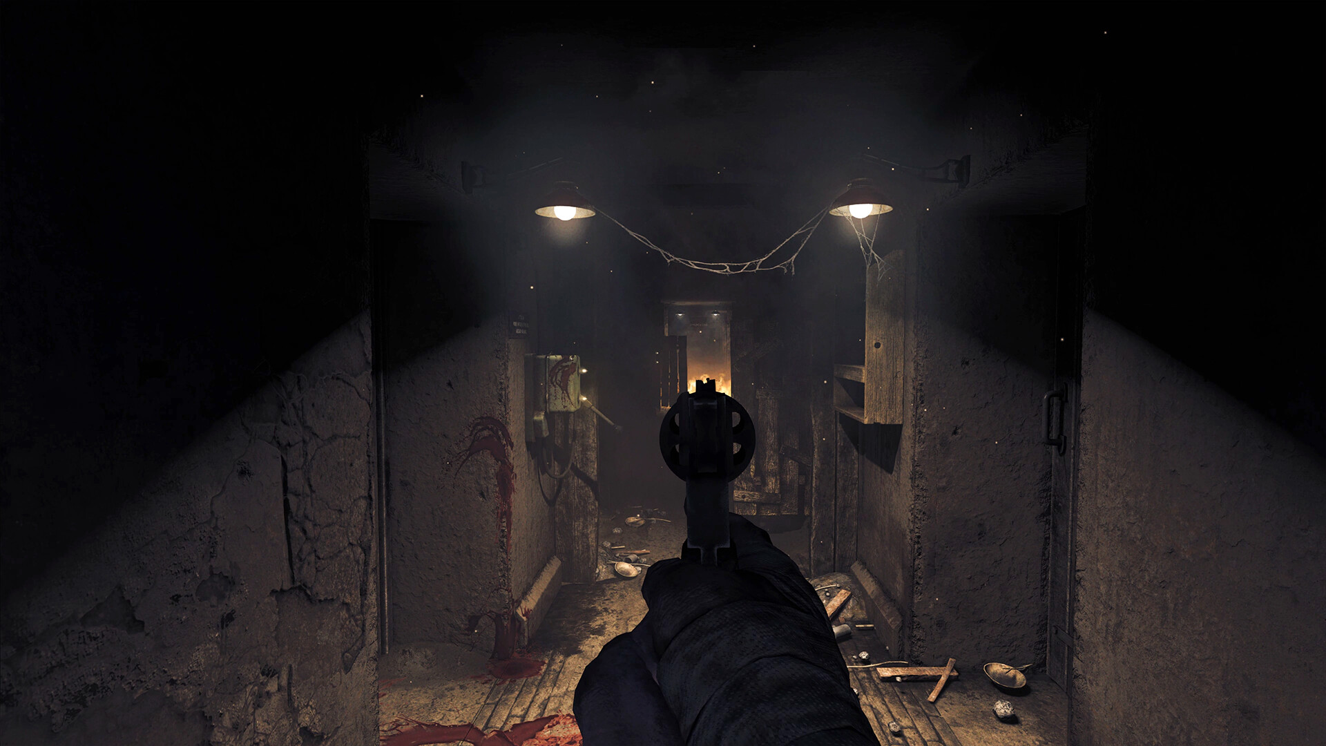A revolver aimed down a dark bunker corridor, with blood marks on a wall