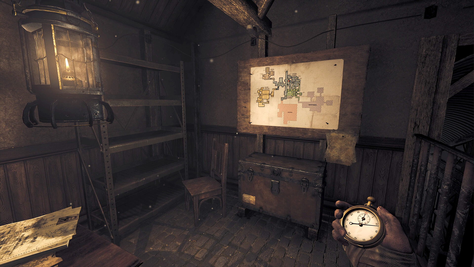 A bunker map beside a lamp, shelves and a chest; Henri holds a pocket watch